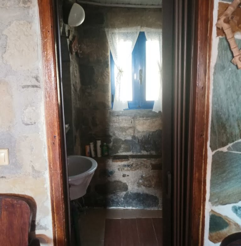 Plot with a traditional stone house in Agios Georgios.