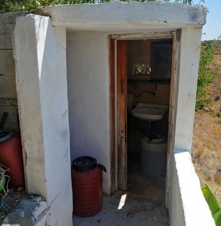 Plot with a traditional stone house in Agios Georgios.