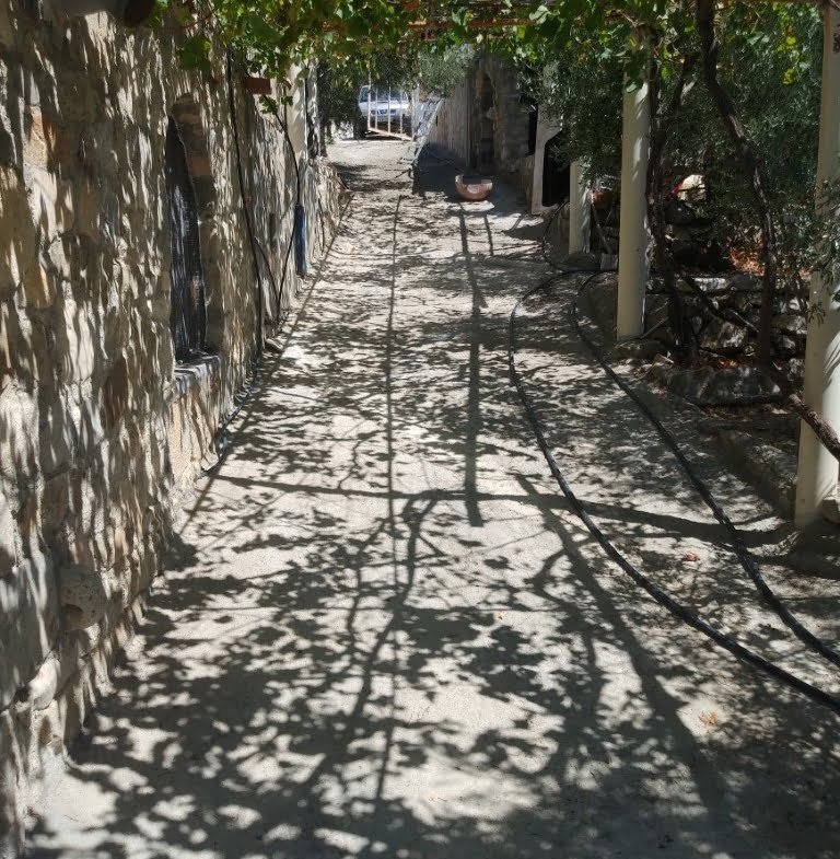 Plot with a traditional stone house in Agios Georgios.