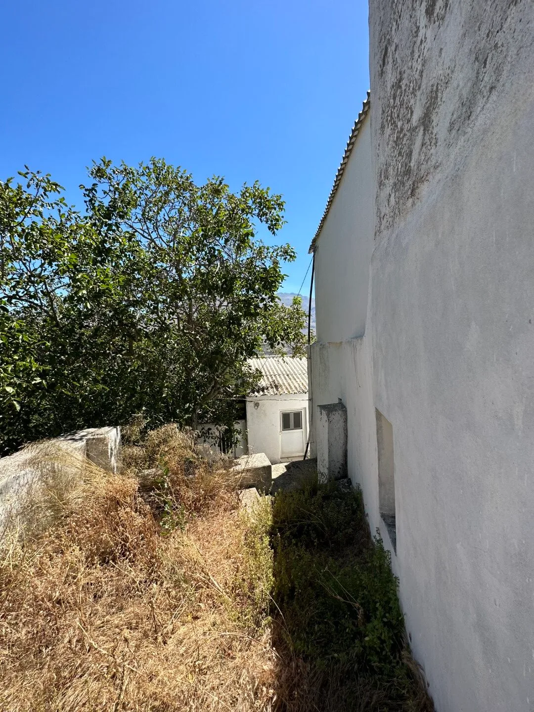 image00008 Plot of 210 sqm with building in the village of Vatos.